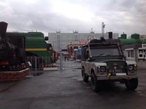 Maggie with trains and big Soviet buildings